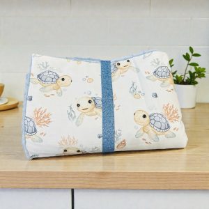 Couverture molletonnée « tortues bleues »